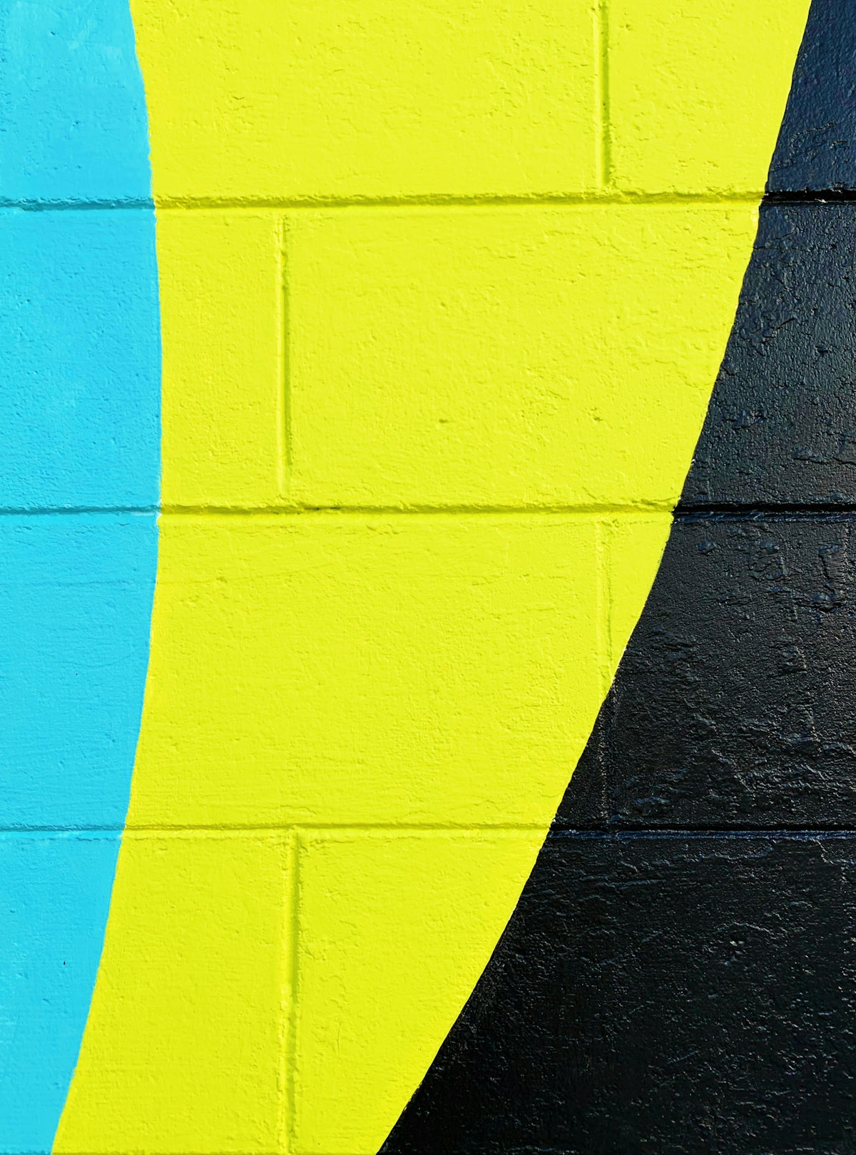 teal, yellow, and black painted wall