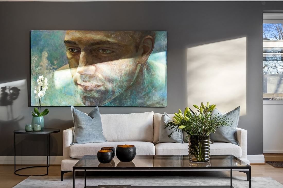 A living room filled with furniture and a painting on the wall