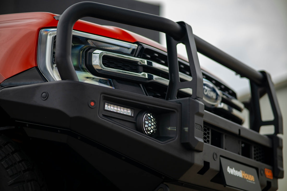 Front view of a red truck with bull bar
