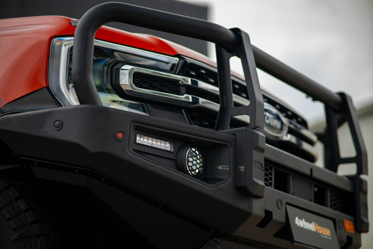 Front view of a red truck with bull bar